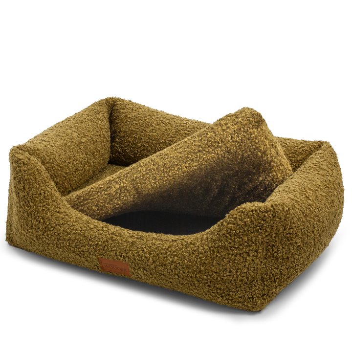 Green dog bed with a removable, washable cover, offering easy cleaning and durability for long-term use.