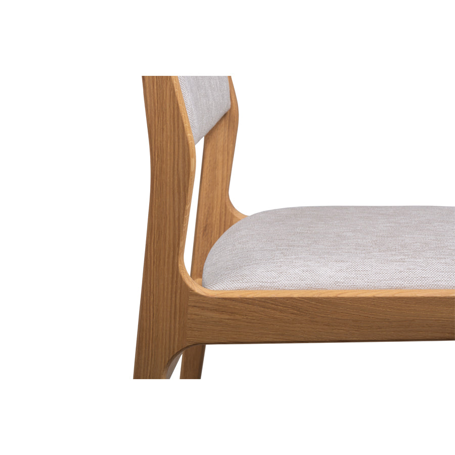 Trendy Scandinavian style oak wood dining chair with seat and backrest upholstered in gray fabric