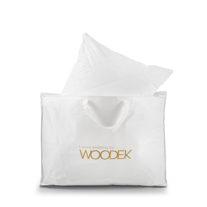 Woodek logo bag with a premium bed pillow inside it