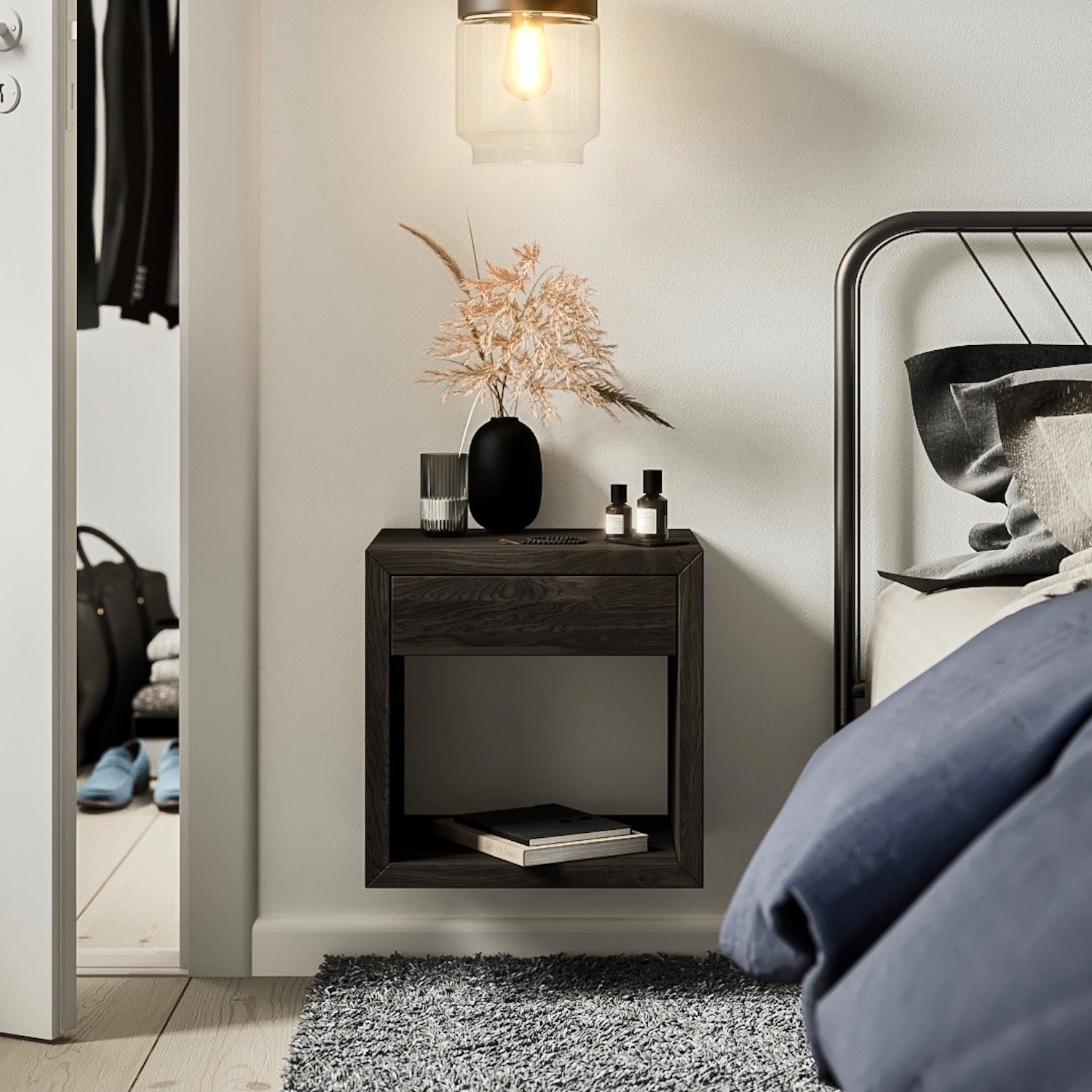 The Hugo nightstand is finely crafted in solid birch wood with a black oil finish. With a minimal style it shows the beauty of the natural wood grain.