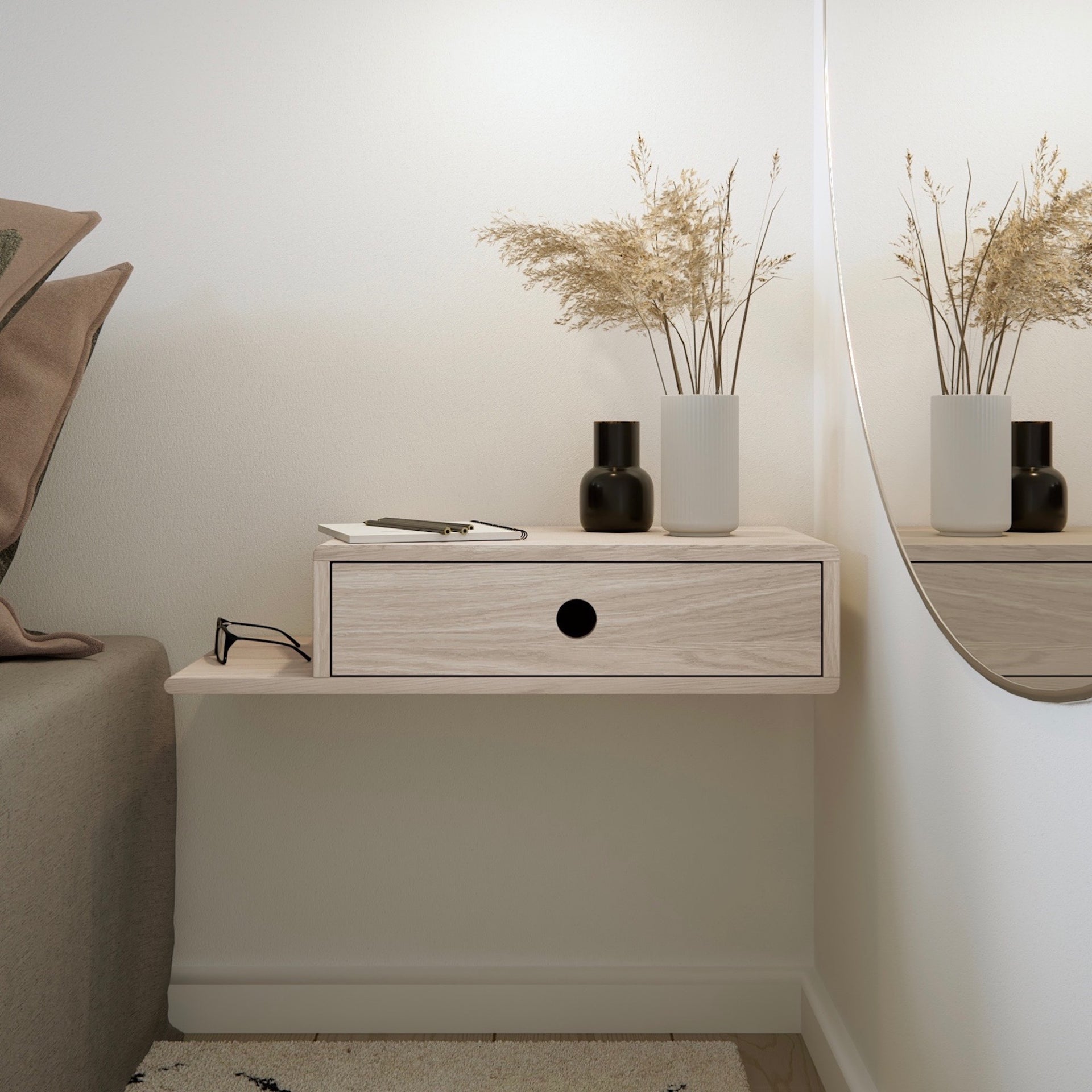 Wall mounted nightstand with a sleek black design, drawer slightly open revealing wooden interior