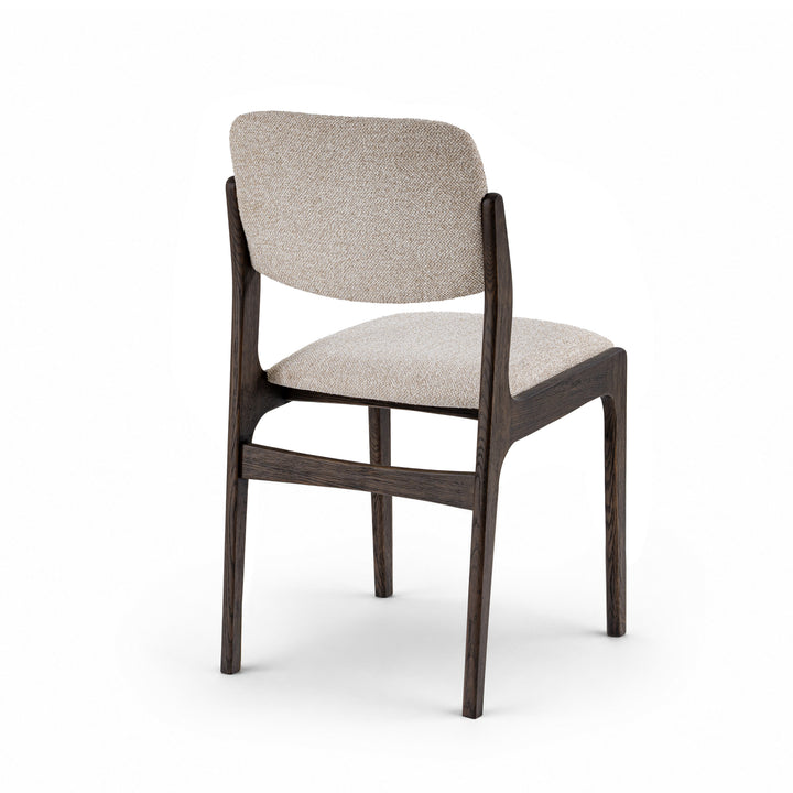 A modern dining chair with a dark brown wooden frame and light beige textured fabric upholstery on the seat and backrest, shown from a three-quarters angle on a white background.