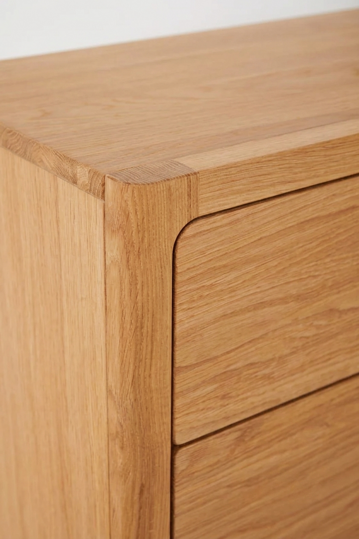 Close-up of Elin Natural Oak Dresser top corner showing premium solid oak grain, and softly rounded edge detail