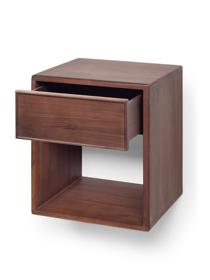 Wooden side table with a drawer on a white background