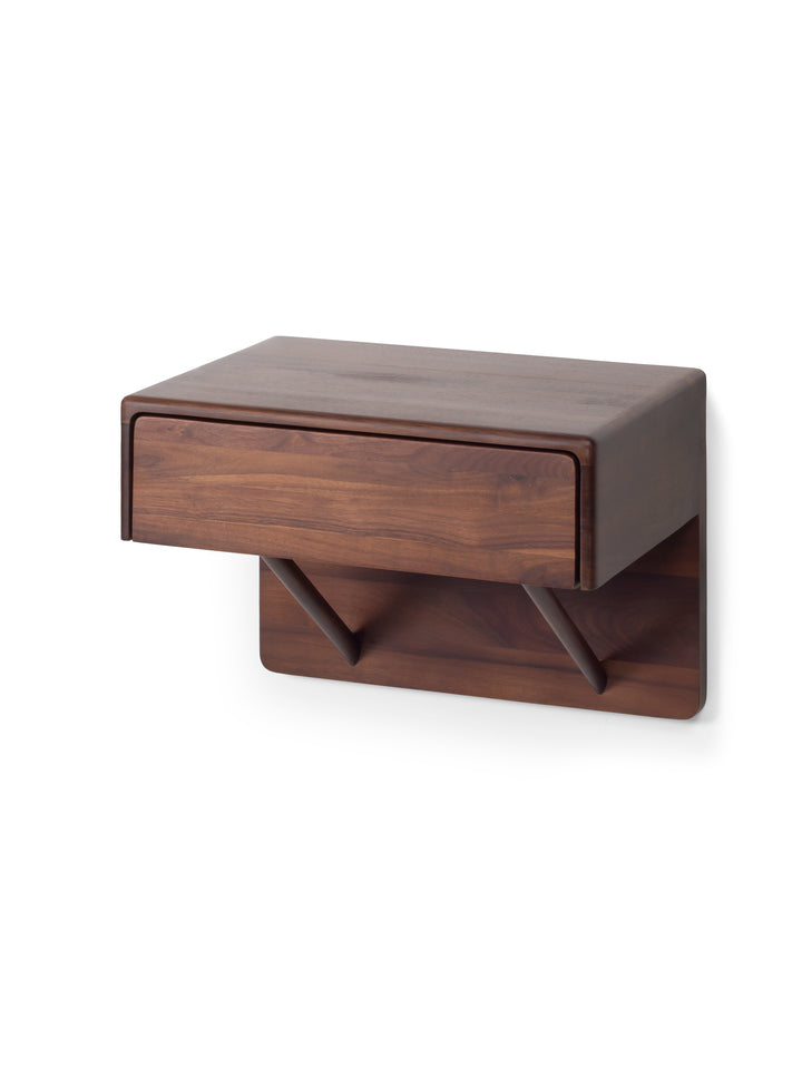 Wooden wall-mounted shelf with a drawer on a white background