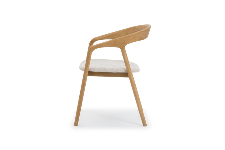 Modern oak chair with sculpted wooden frame and light cobble upholstered seat