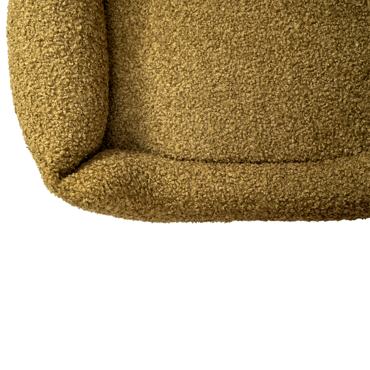 Top-down view of a durable and plush dog bed with raised bolsters, designed for orthopedic support