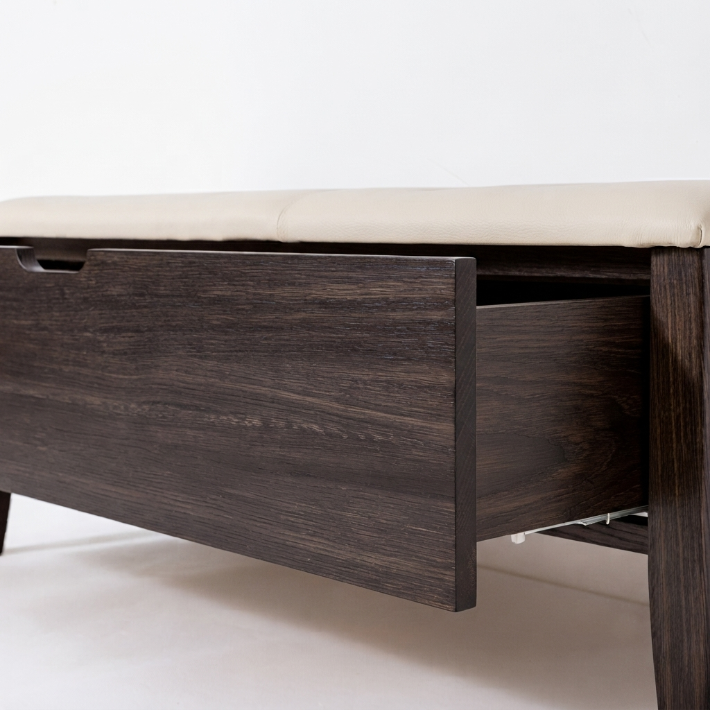 A dark brown wooden storage bench with a light beige cushioned top and an open drawer, shown against a plain white background.