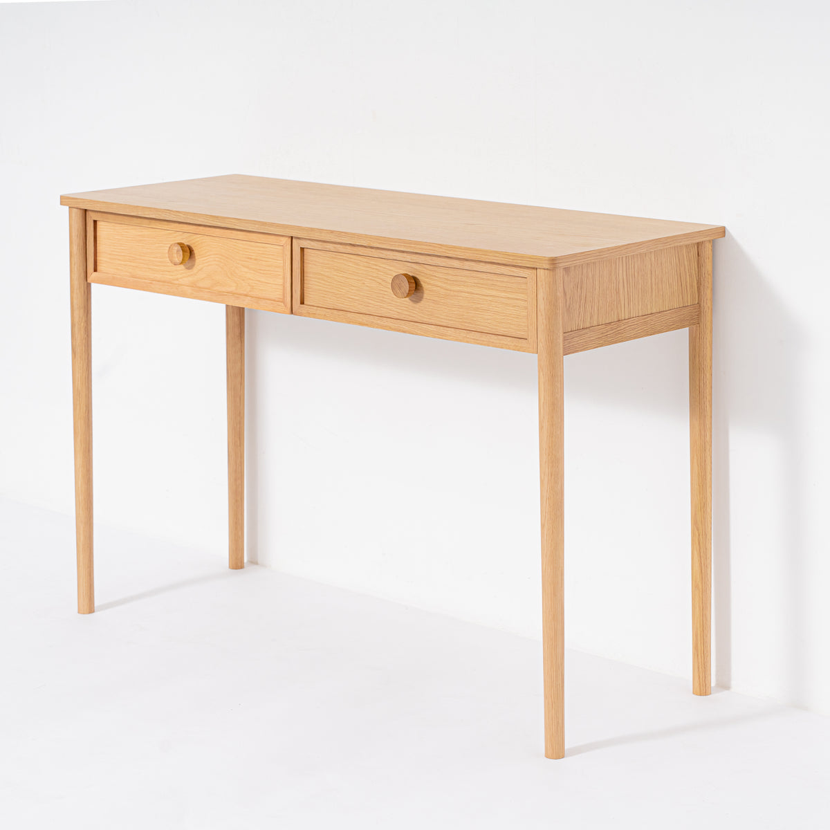 Wooden desk with two drawers on a white background