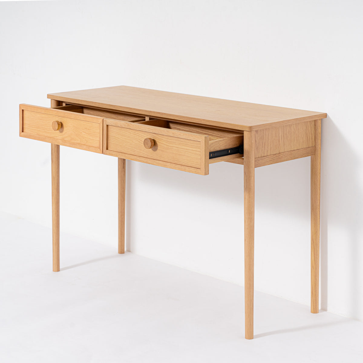 Wooden desk with two drawers on a white background