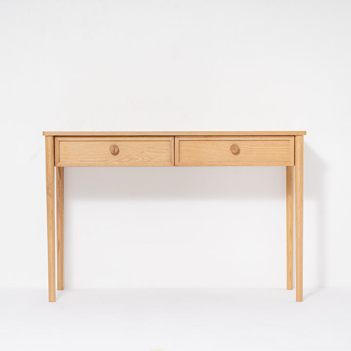 Wooden desk with two drawers on a white background