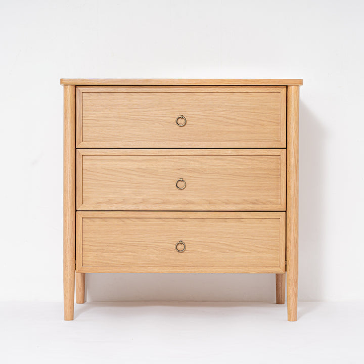 Wooden dresser with three drawers on a white background