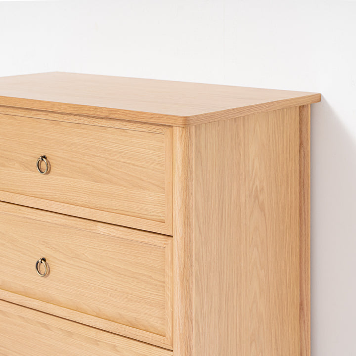 Wooden dresser with three drawers on a white background