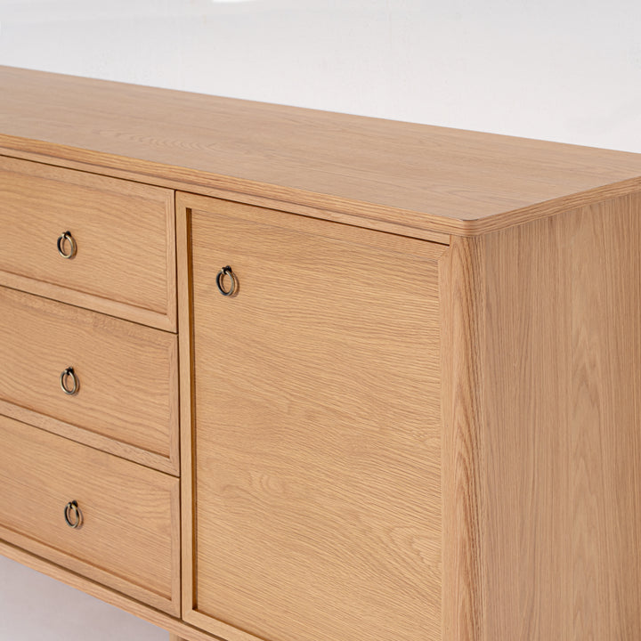 Wooden dresser with drawers and a door on a white background