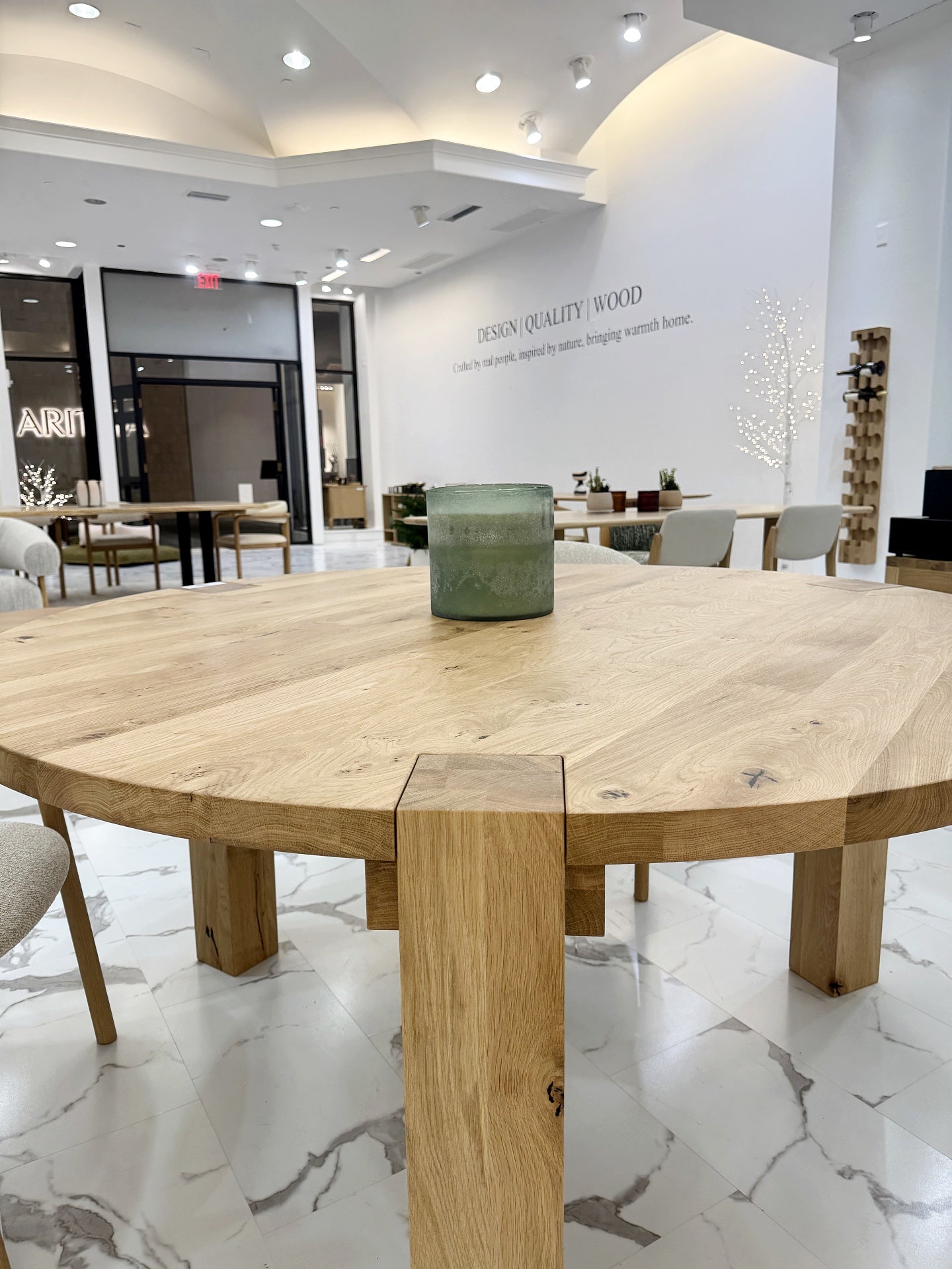 Handmade circular oak dining table with visible grain patterns and rustic natural tone