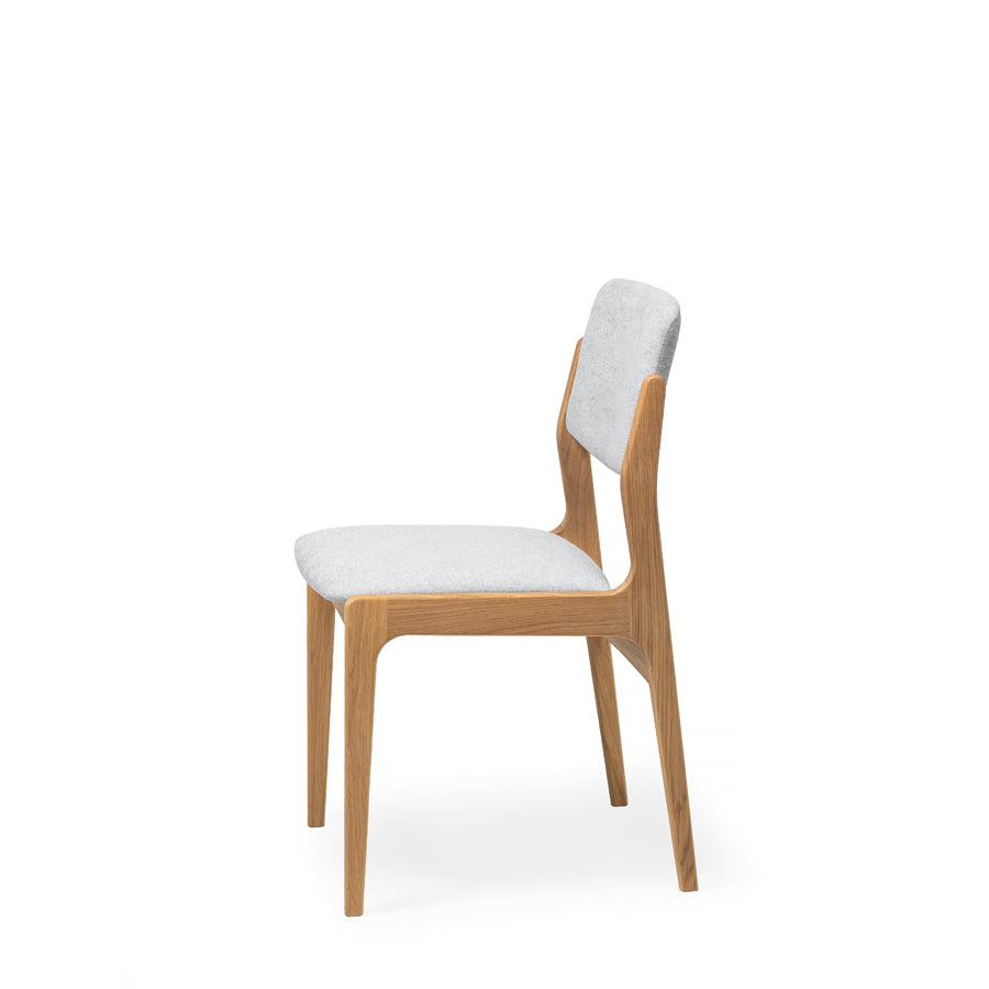 Trendy Scandinavian style oak wood dining chair with seat and backrest upholstered in gray fabric