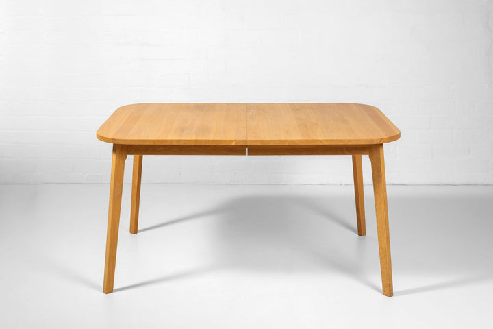 BERG Extendable Dining Table – Handcrafted Solid Oak Hardwood with smooth natural finish, slender legs, gallery position 1 file KH_6051