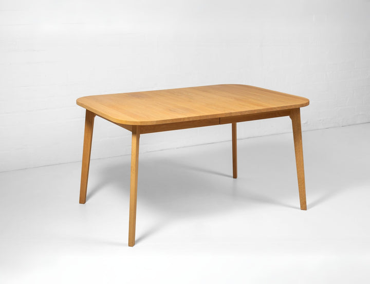 BERG Extendable Dining Table – Handcrafted Solid Oak Hardwood with smooth natural finish and slender tapered legs, gallery position 1 file KH_6046