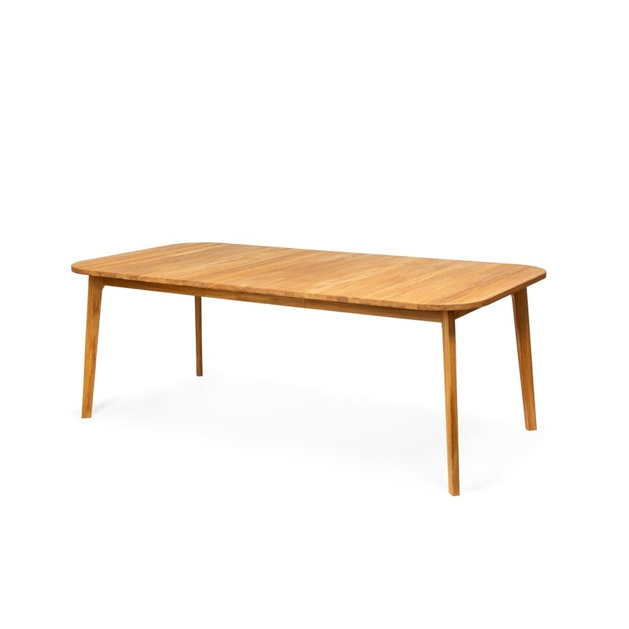 Artisanal solid oak dining table with extension mechanism and unique grain patterns