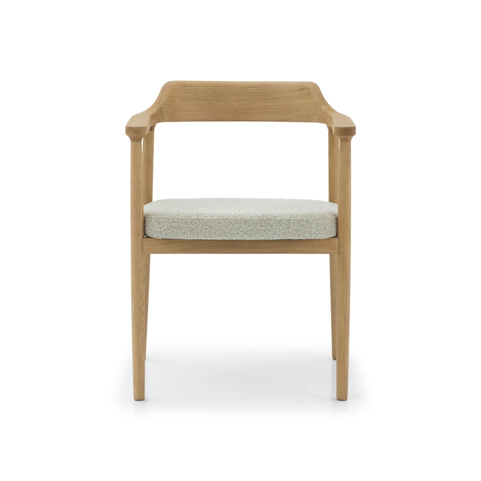 Elegant oak dining chair with slender frame, upholstered seat, and natural wood grain