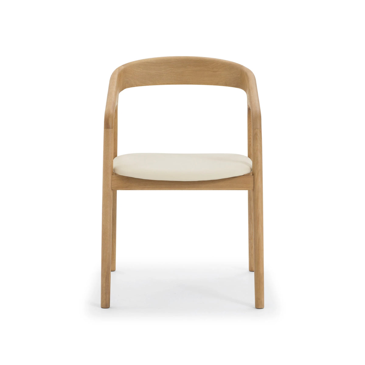 Celeste Oak Dining Chair straight front view showing symmetrical solid oak frame, curved open backrest, and round beige leather seat cushion