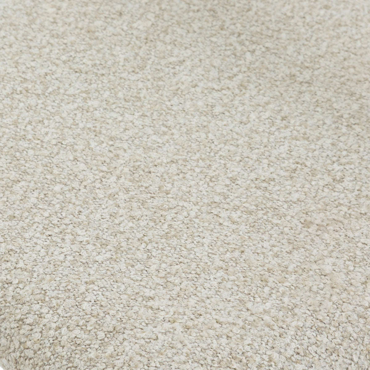 Extreme close-up of Cloud fabric upholstery showing soft off-white boucle texture used on the Celeste Oak Dining Chair seat