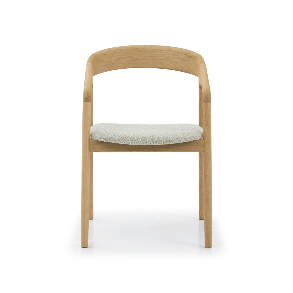Celeste Oak Dining Chair front view showing symmetrical solid oak frame, curved backrest, and round off-white Cloud fabric seat
