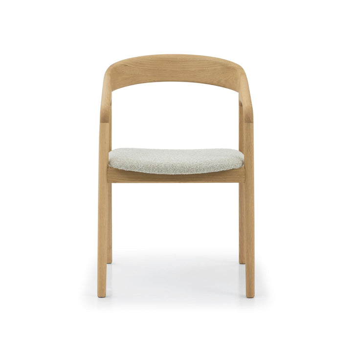 Celeste Oak Dining Chair front view showing symmetrical solid oak frame, curved backrest, and round off-white Cloud fabric seat