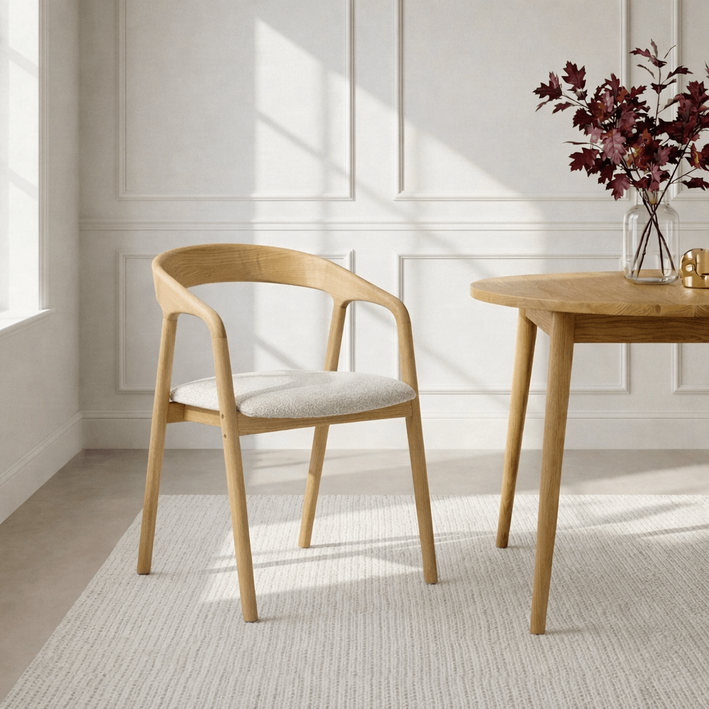 Celeste Oak Dining Chair lifestyle view in a Scandinavian dining room with natural oak frame and off-white Cloud fabric seat