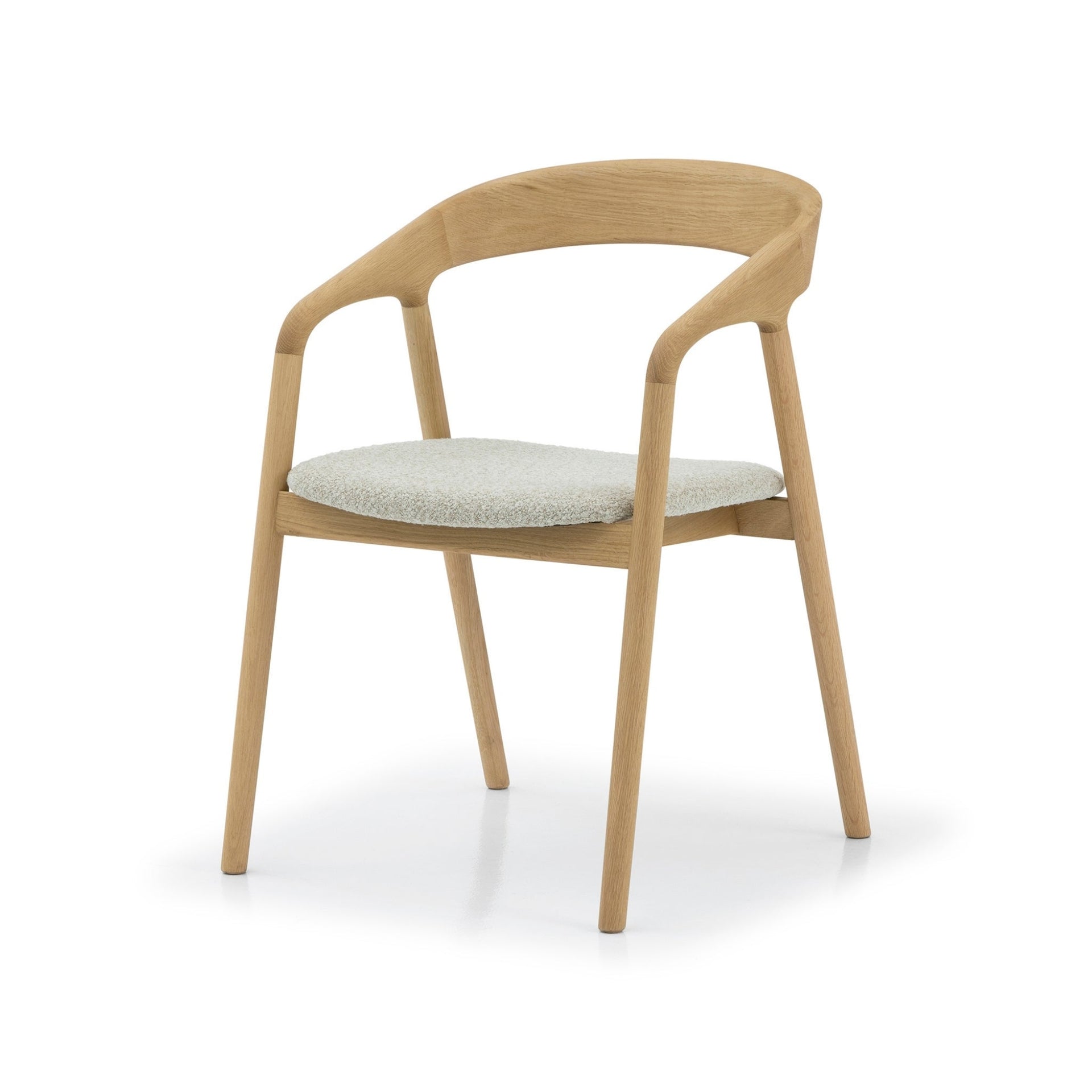 Celeste Oak Dining Chair angled three-quarter view showing curved backrest, solid oak armrests, and off-white Cloud fabric seat