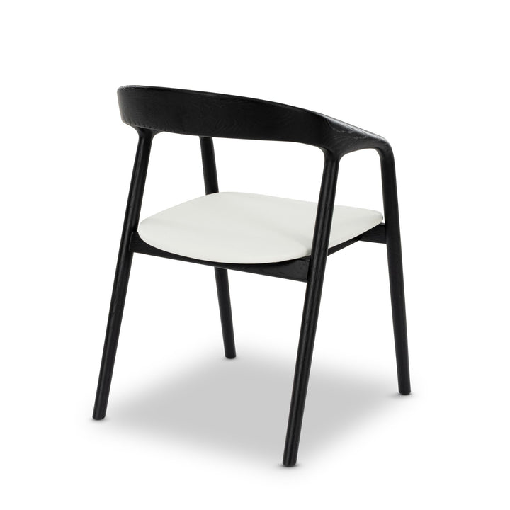 Celeste American White Oak Dining Chair - deep black finish revealing oak grain, white leather seat, dining room setting