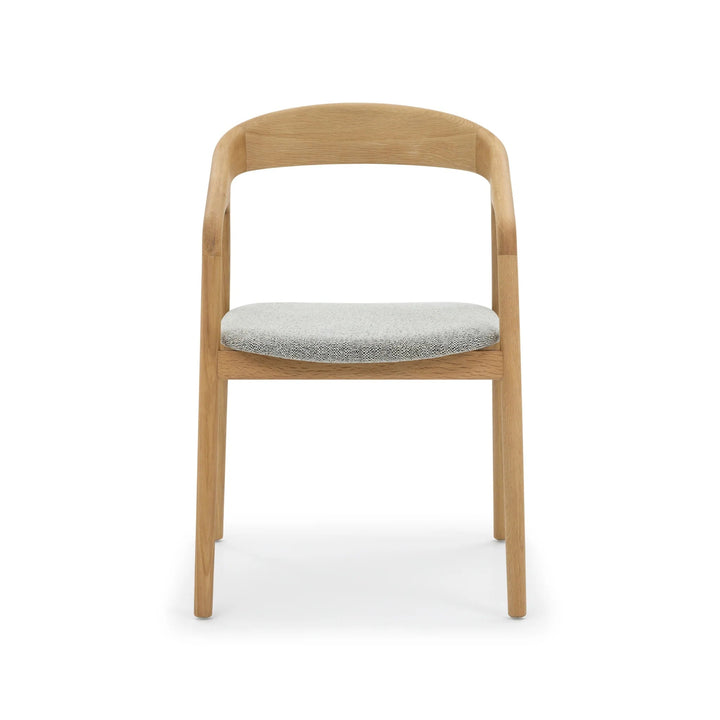 Celeste Oak Dining Chair straight front view showing solid oak frame, open curved backrest, and light grey Noel fabric seat