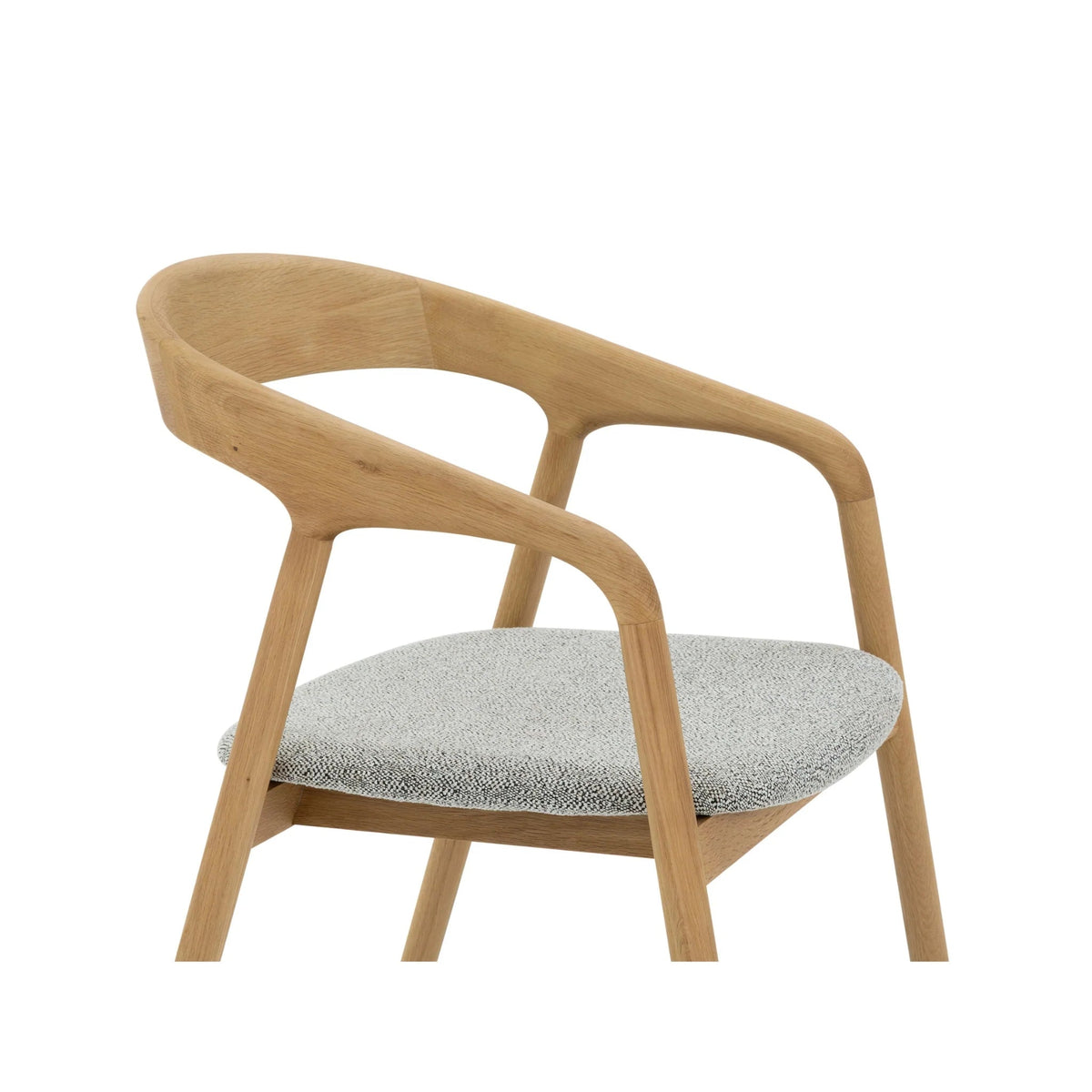 Close-up of Celeste Oak Dining Chair upper frame from above showing curved open backrest, and light grey Noel fabric seat