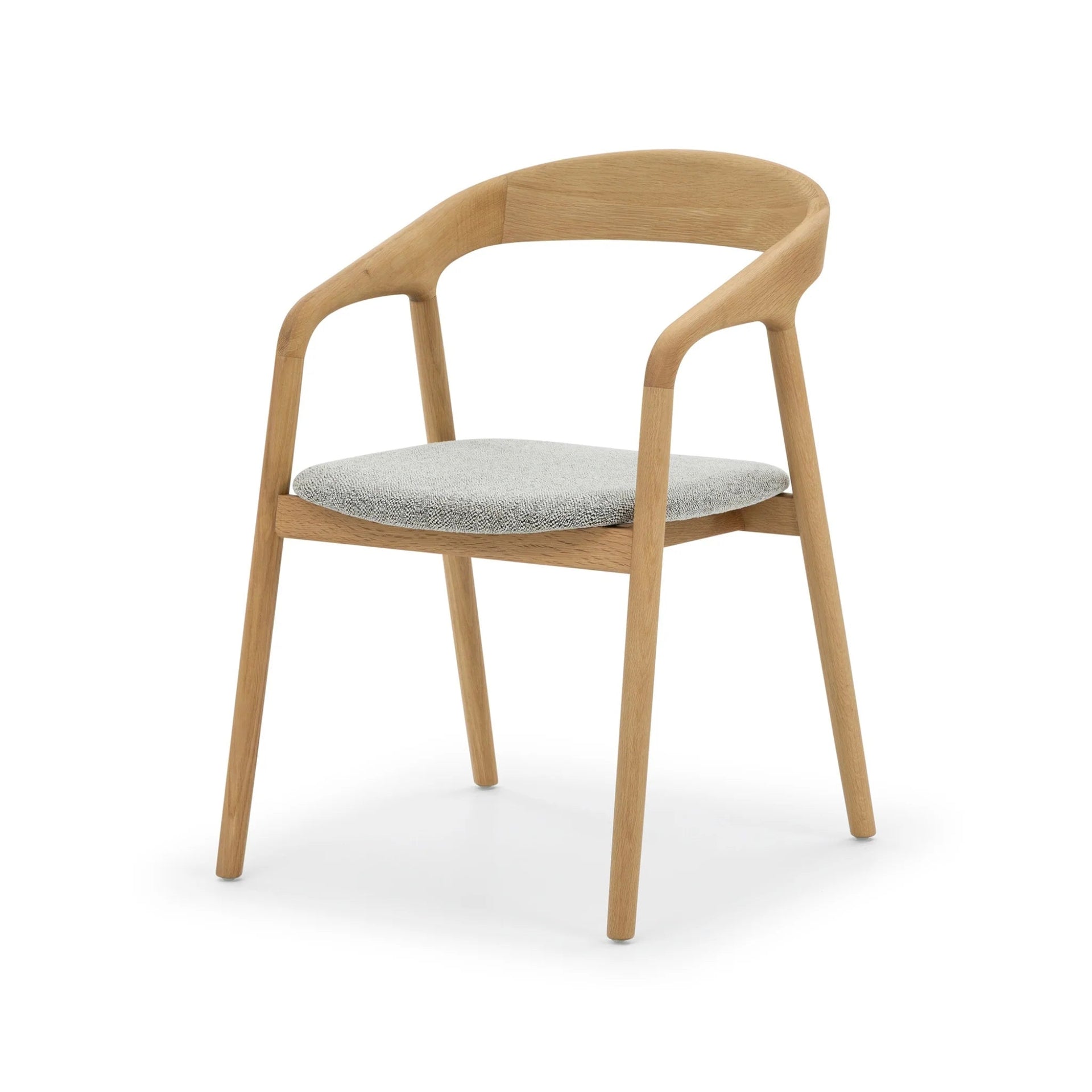Celeste Oak Dining Chair angled three-quarter view showing curved open backrest, and light grey Noel fabric seat
