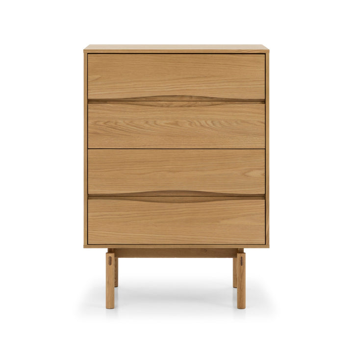 Celeste 4-Drawer Oak Dresser straight front view showing symmetrical drawer layout with carved oak pull handles and tapered legs