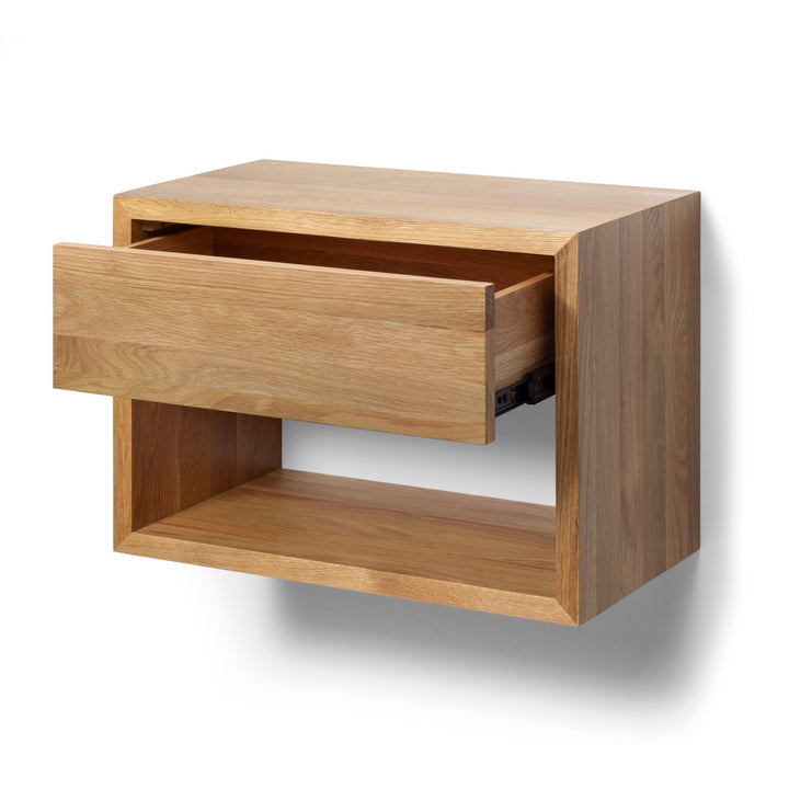 Floating Oak Wood Wide Nightstand Hugo with a drawer and open shelf in solid oak, showcasing minimalist Scandinavian design and natural oak wood finish.