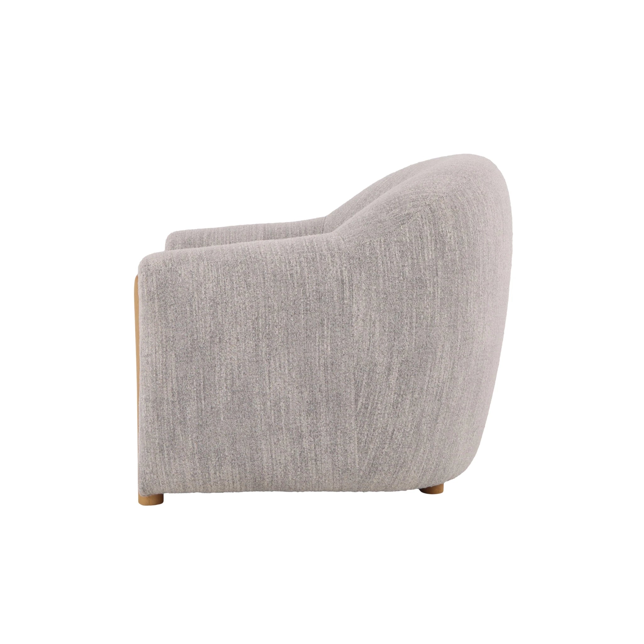 Contemporary oak armchair with light grey fabric and smooth sculpted silhouette