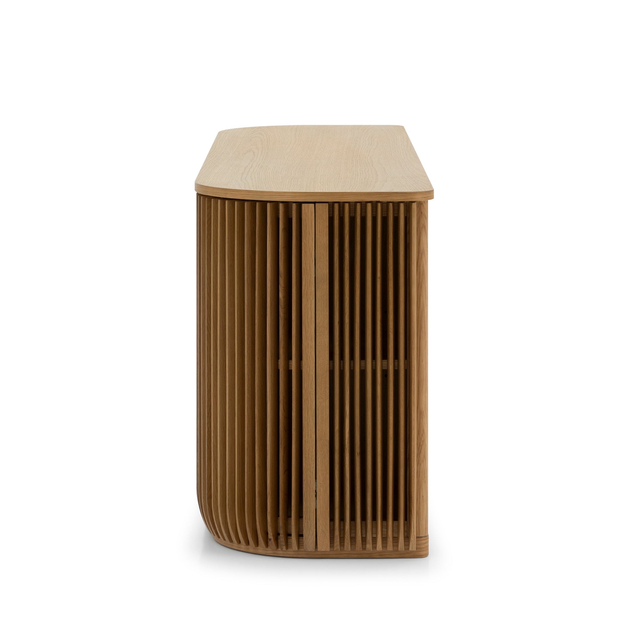 Franz Oak Sideboard side view highlighting its curved ribbed doors and natural solid oak in minimalist Scandinavian design, gallery position 1.
