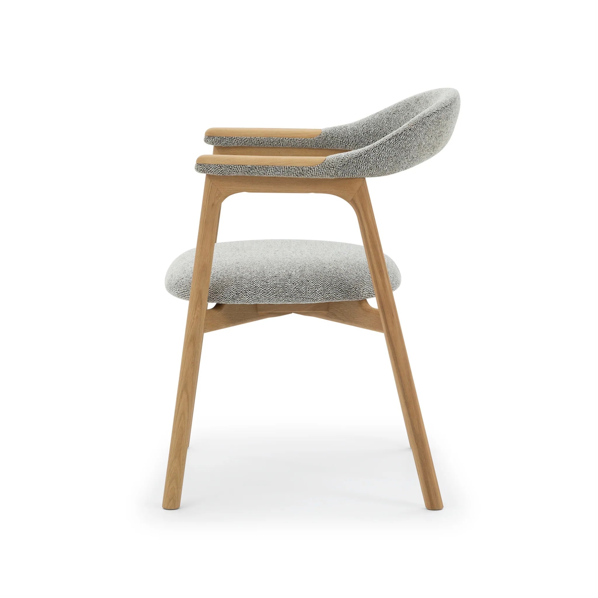 Timeless oak dining chair with soft Noel fabric seat and curved backrest
