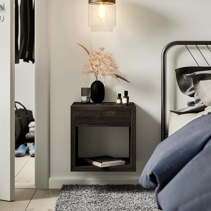 The Hugo nightstand is finely crafted in solid birch wood with a black oil finish. With a minimal style it shows the beauty of the natural wood grain.