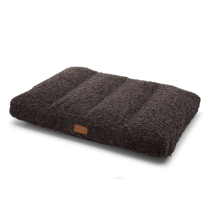 Dark grey orthopedic dog mattress with removable bouclé cover and non-slip base