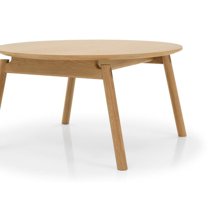Natural Oak Wood Coffee Table Celeste with round solid oak top and angled legs in Scandinavian minimalist style, gallery position 1.