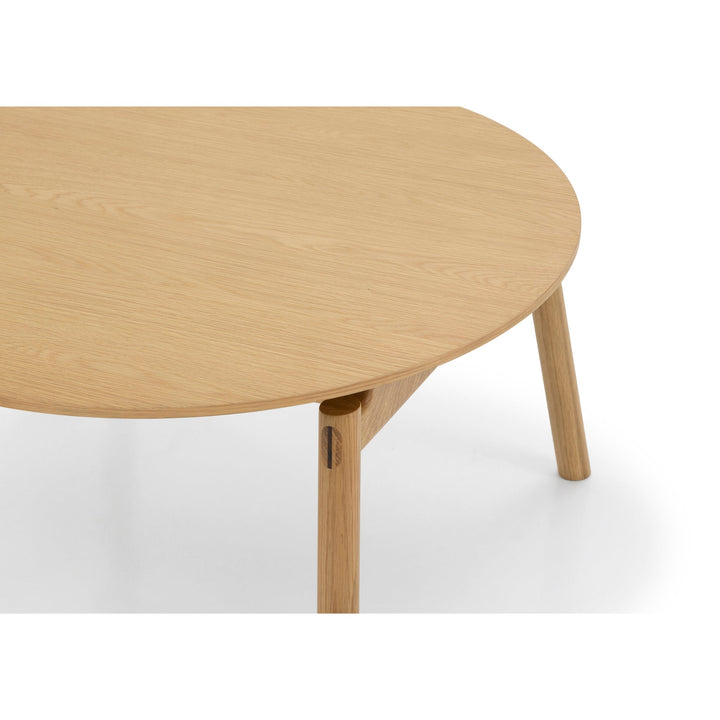 Natural Oak Wood Coffee Table Celeste close-up of round tabletop and angled legs in minimalist Scandinavian solid oak design, gallery position 1