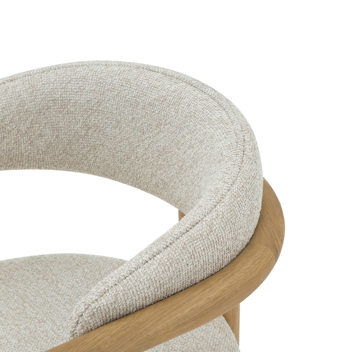 Nature – Designer Oak Hardwood Chair close-up on curved backrest and armrest with light textured upholstery, natural solid oak frame, Cobble variant, gallery 1