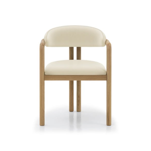 Nature Oak Dining Chair straight front view showing symmetrical solid oak frame, open armrests, and round beige leather seat