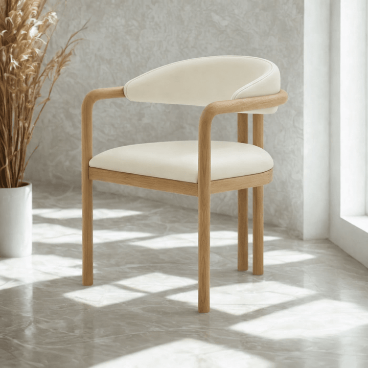 Nature Oak Dining Chair front view showing rounded beige leather backrest, upholstered seat, and solid oak armrest frame