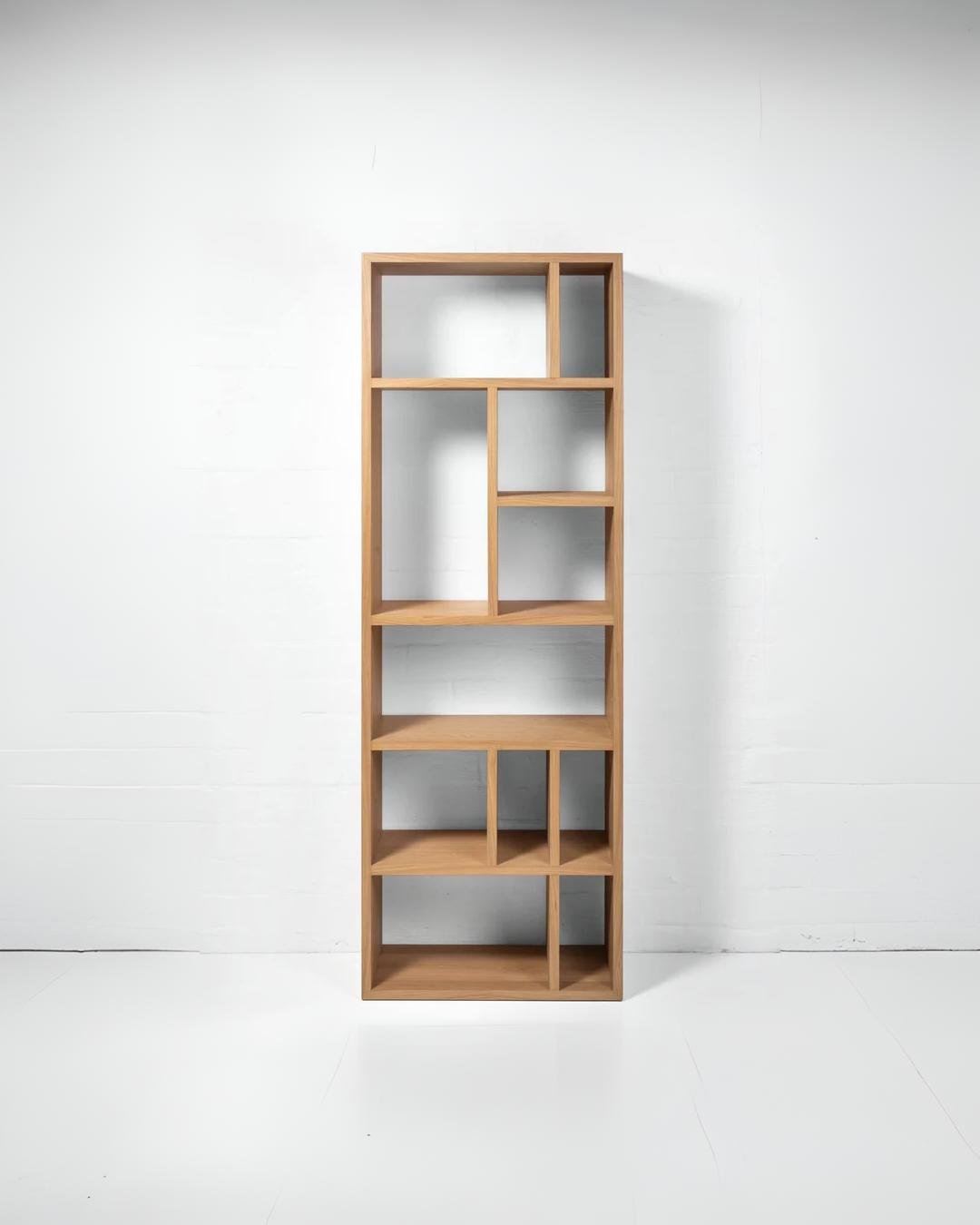 Contemporary oak bookcase with clean lines and versatile shelving layout