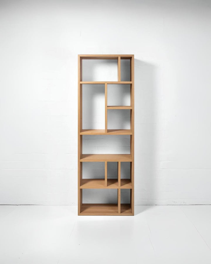 Contemporary oak bookcase with clean lines and versatile shelving layout