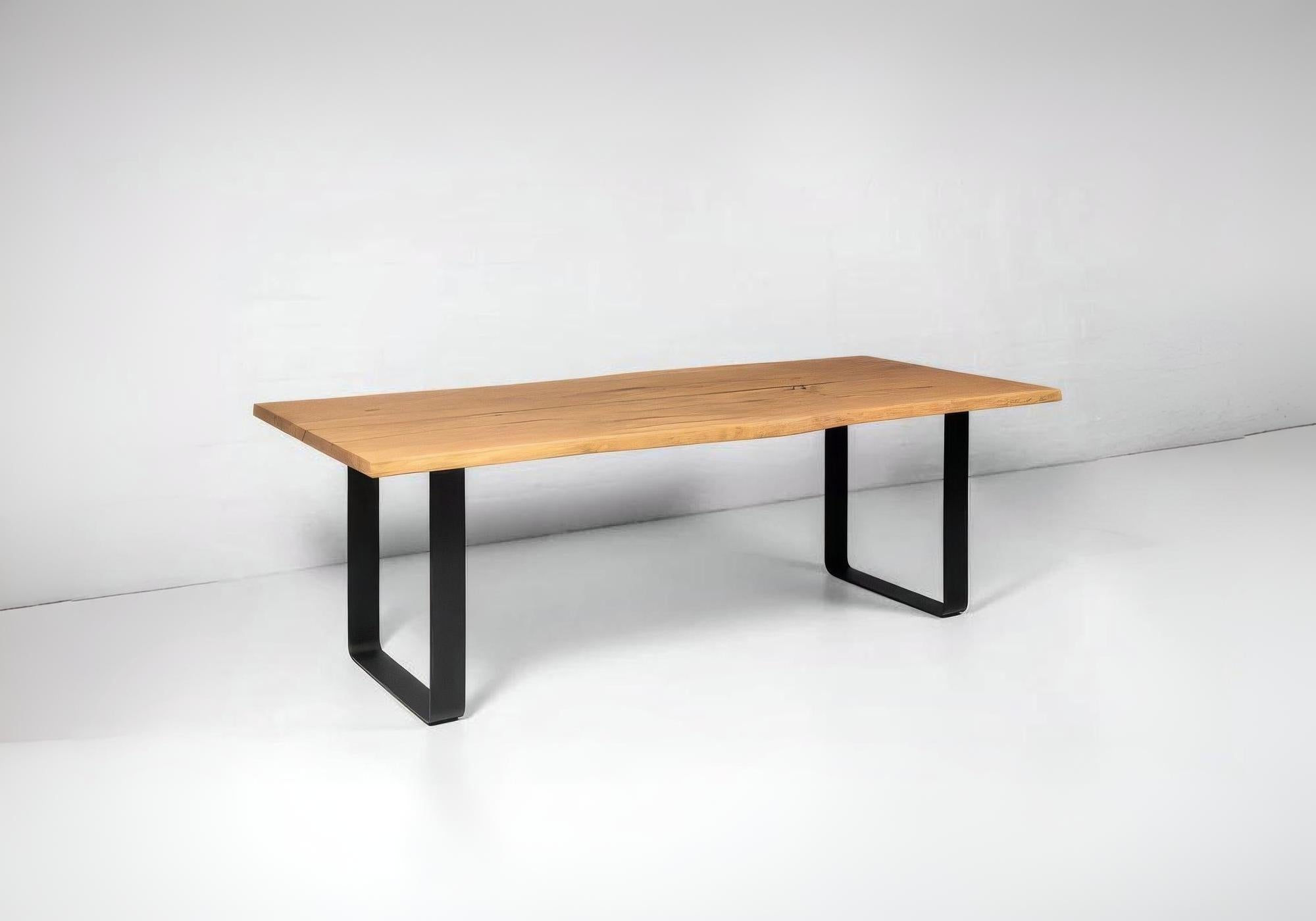 Handmade oak dining table with smooth natural finish and timeless farmhouse style