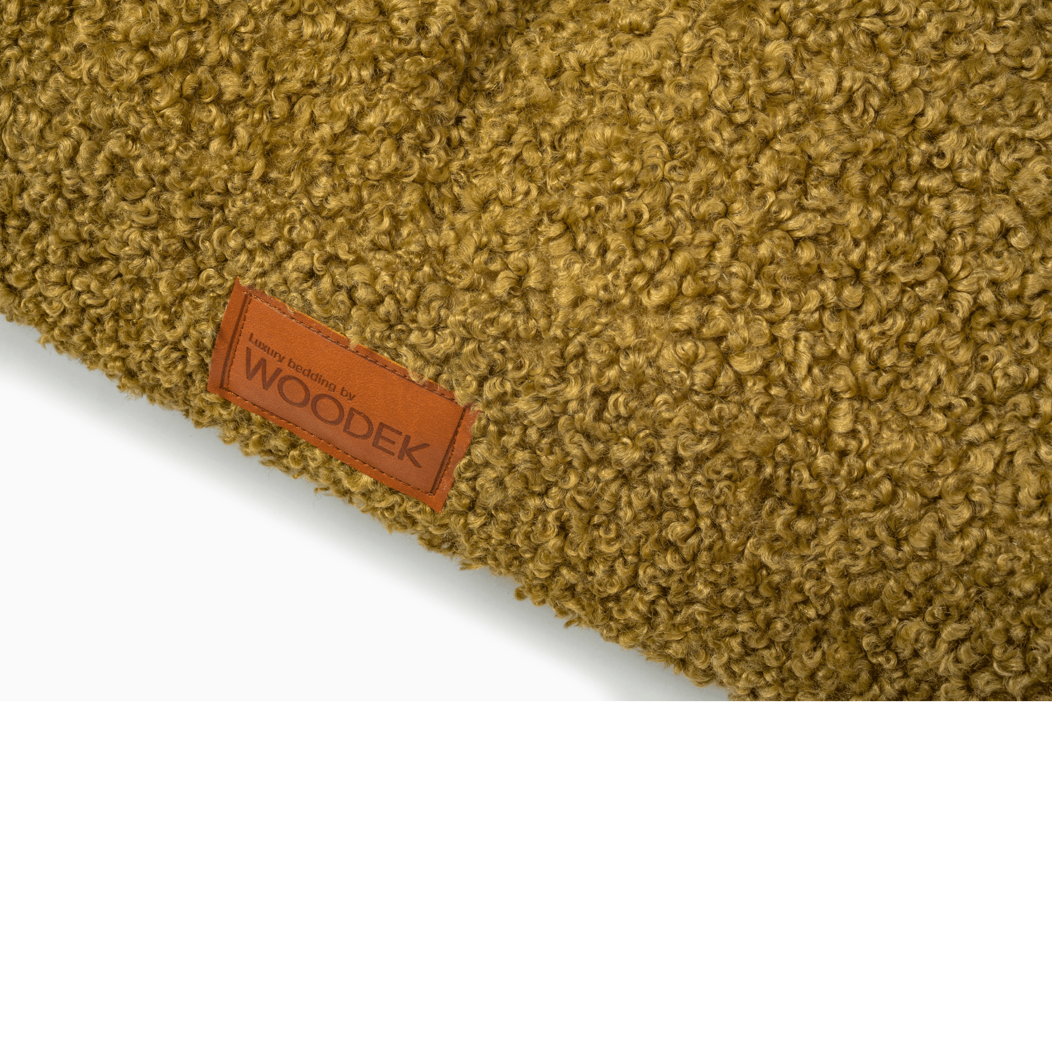 Orthopedic Dog Bed in Green with Luxurious Removable Fabric close-up of textured fabric and Woodek leather brand tag, gallery position 1.